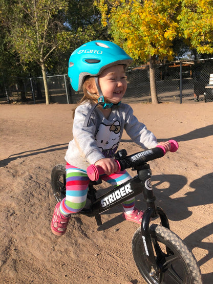 Strider 12” Sport Bike, Black - No Pedal Balance Bicycle for Kids 1 to 4 Years - Includes Safety Pad, Padded Seat, Mini Grips & Flat-Free Tires - Tool-Free Assembly & Adjustments