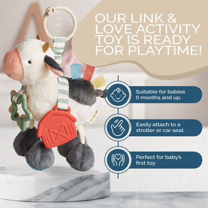 Itzy Ritzy Link & Love Toy for Stroller or Car Seat – Features Textured Ribbons, Crinkle Sounds, Clinking Rings & Silicone Teether – Designed for Ages 0 Months and Up (Cow)
